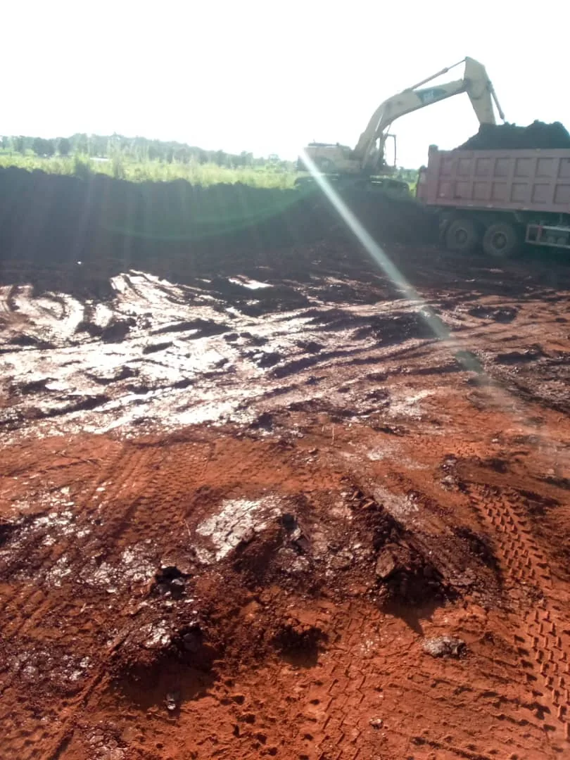 Excavator loading truck